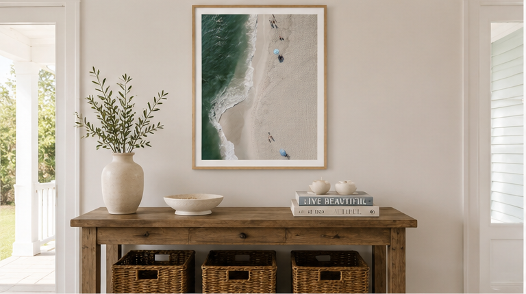 The Point 30x40 natural oak frame above a coastal entryway console